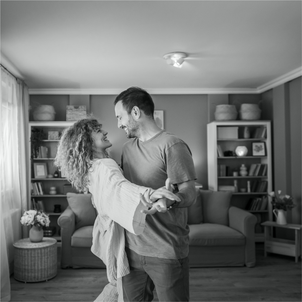 Couple spending time in the living room of their home